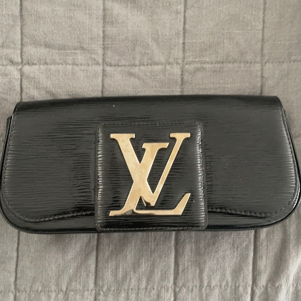 LV Patent leather clutch.